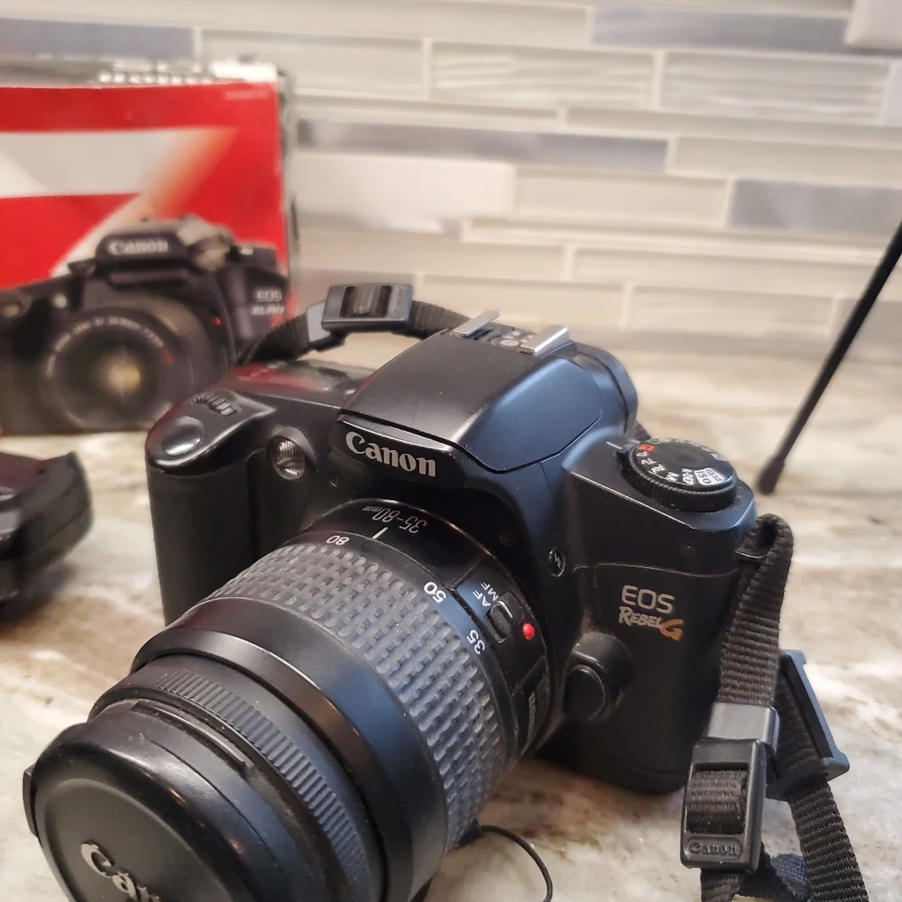 Canon EOS Elan 7 and EOS Rebel G With Lens And Accessories (see notes)